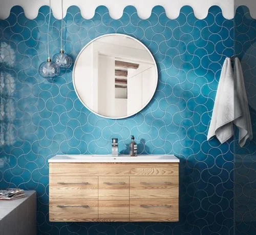 Blue fan-shaped wall tiles by Equipe in a bathroom